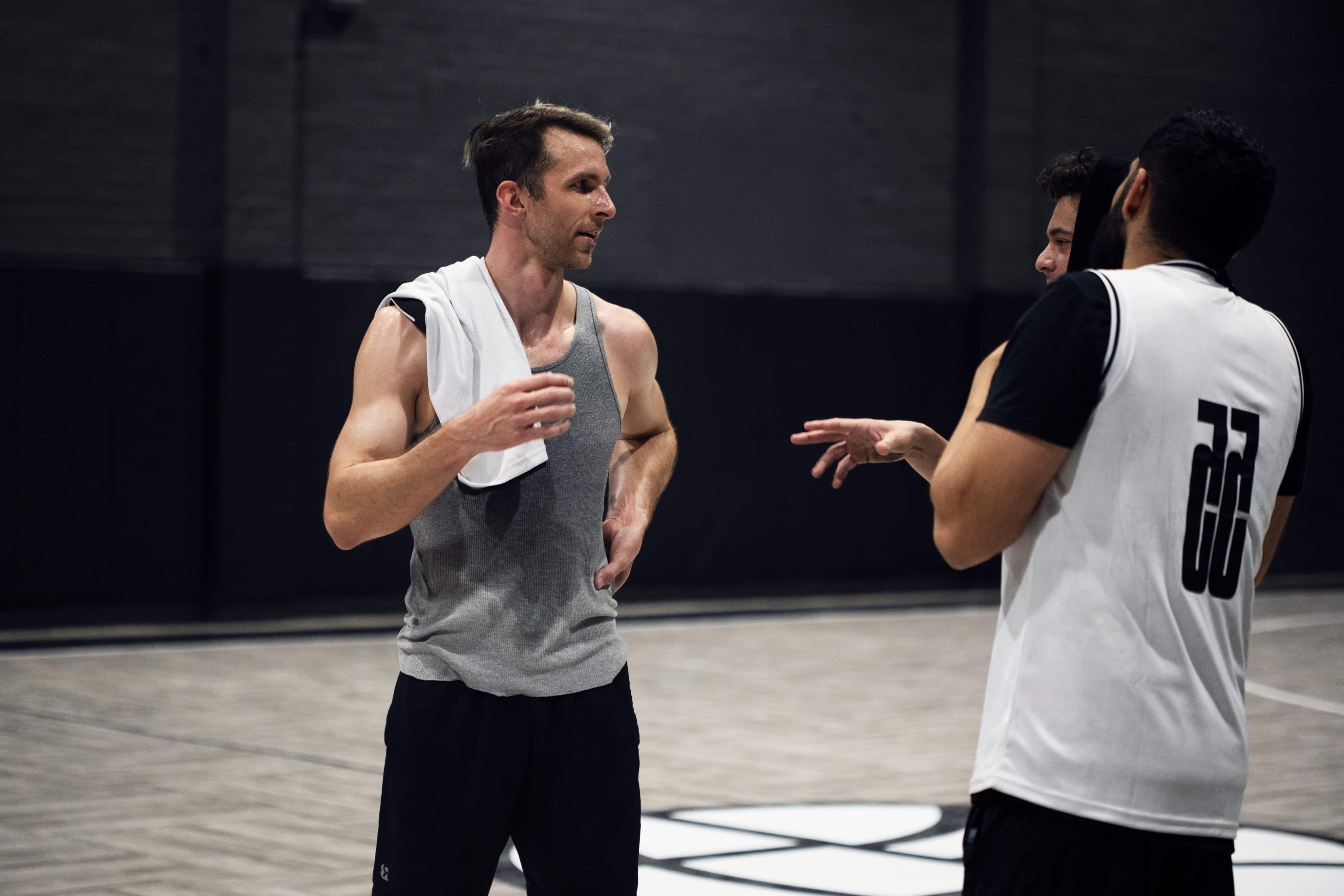 Two players talking after a run